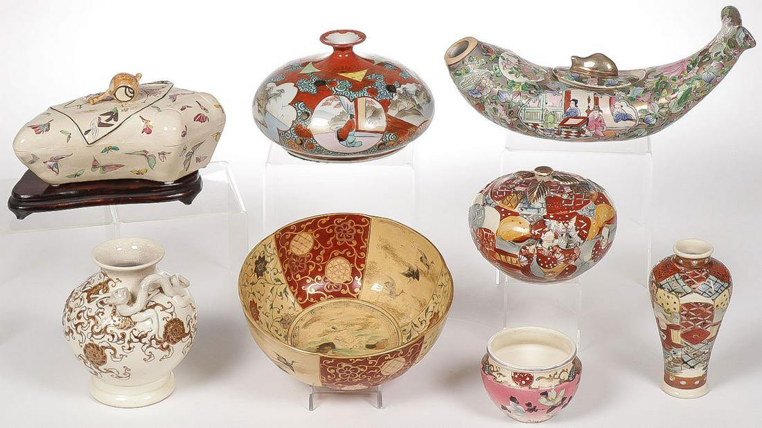 JAPANESE SATSUMA WARE: JAPANESE SATSUMA WARE. Comprising various vessels including bowls, vases, covered boxes, as well as a Chinese famille rose decorated fish form lidded vessel, as shown. Greatest measurement 12.25 inche