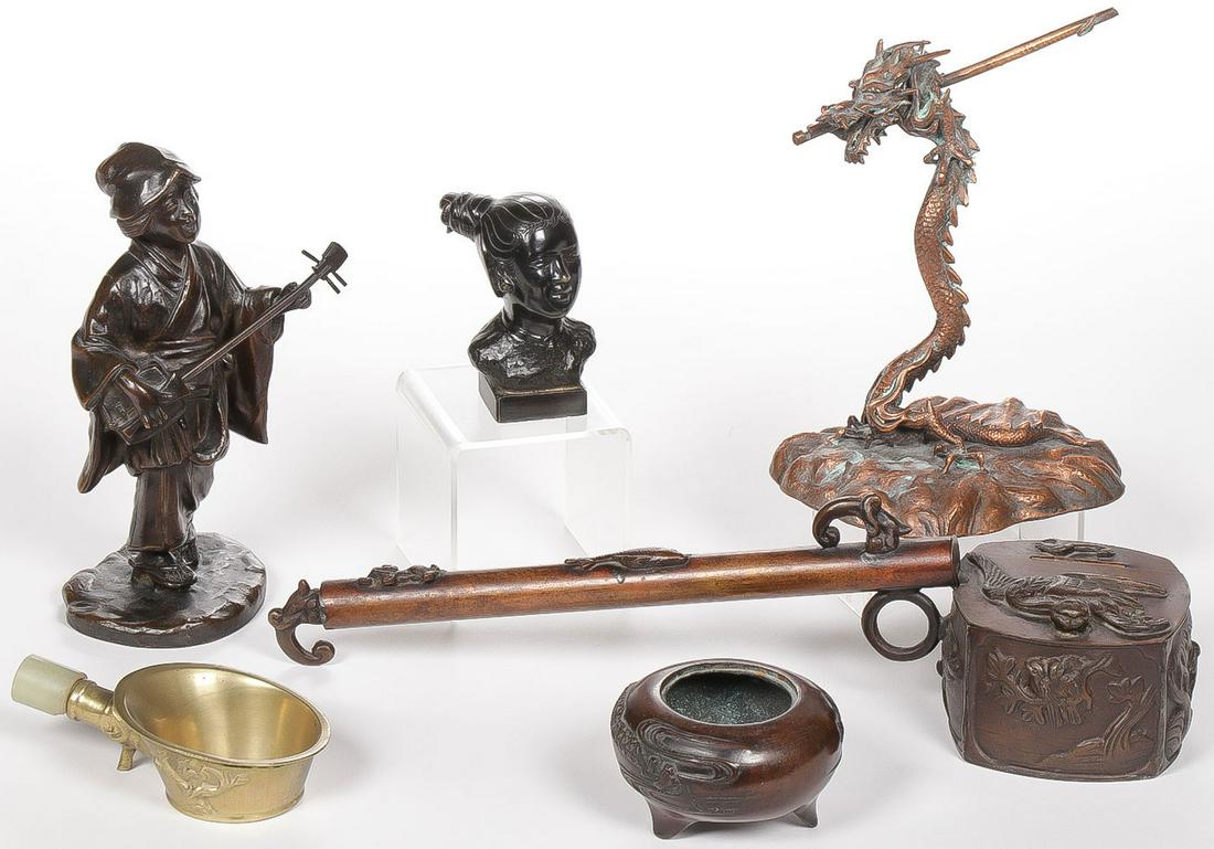 ASIAN METAL GROUP: ASIAN METAL GROUP. Including six individual pieces, consisting of a copper brush holder and ink pot, a metal dragon stand, a bronze Japanese okimono of a woman playing a shamisen with impressed mark o