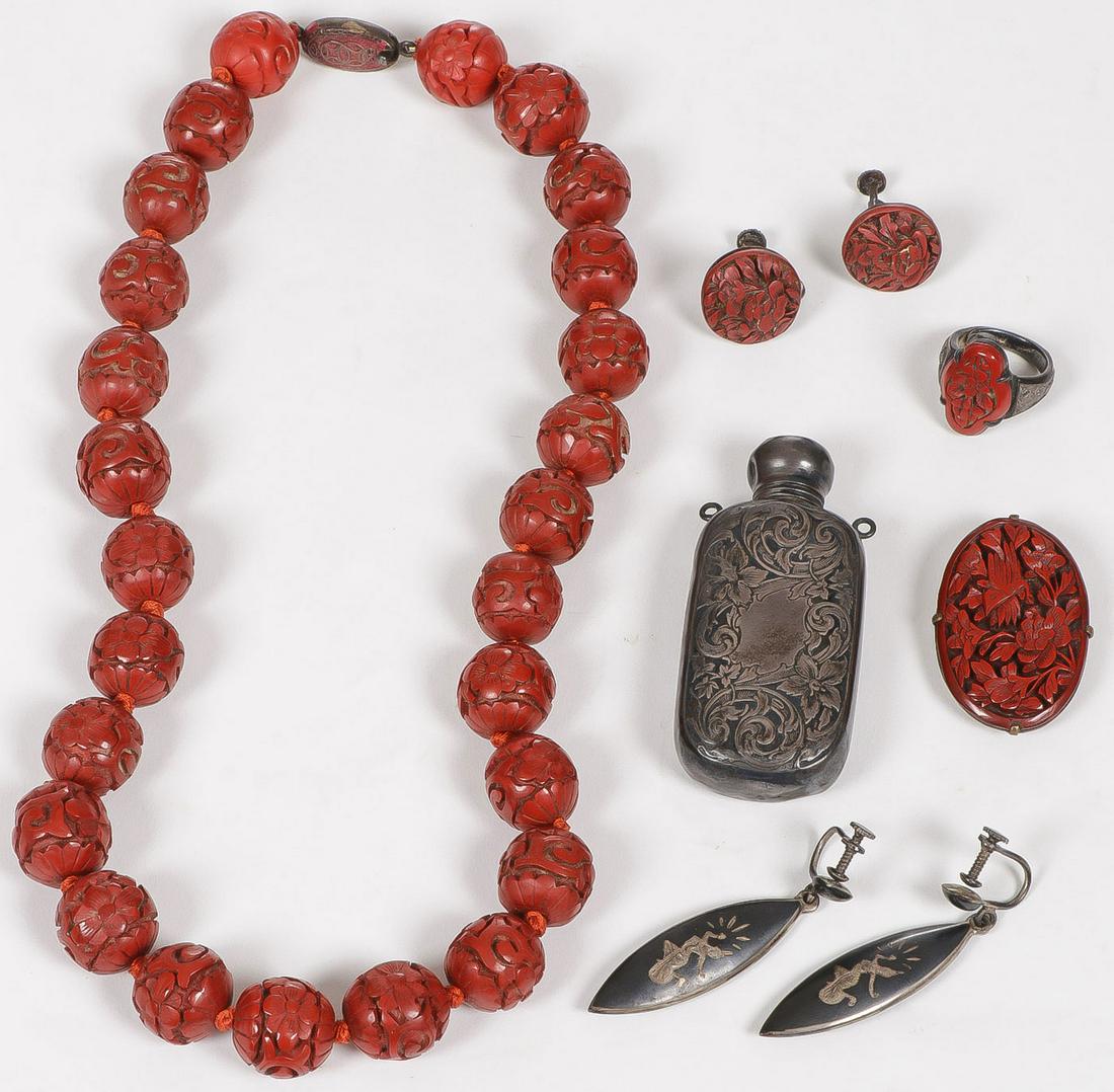 CHINESE JEWELRY CINNABAR GROUP: CHINESE JEWELRY CINNABAR GROUP. Comprising seven individual pieces, including a cinnabar necklace, cinnabar brooch, ring and pair of matching earrings. As well as a pair of silver Burmese earrings. A