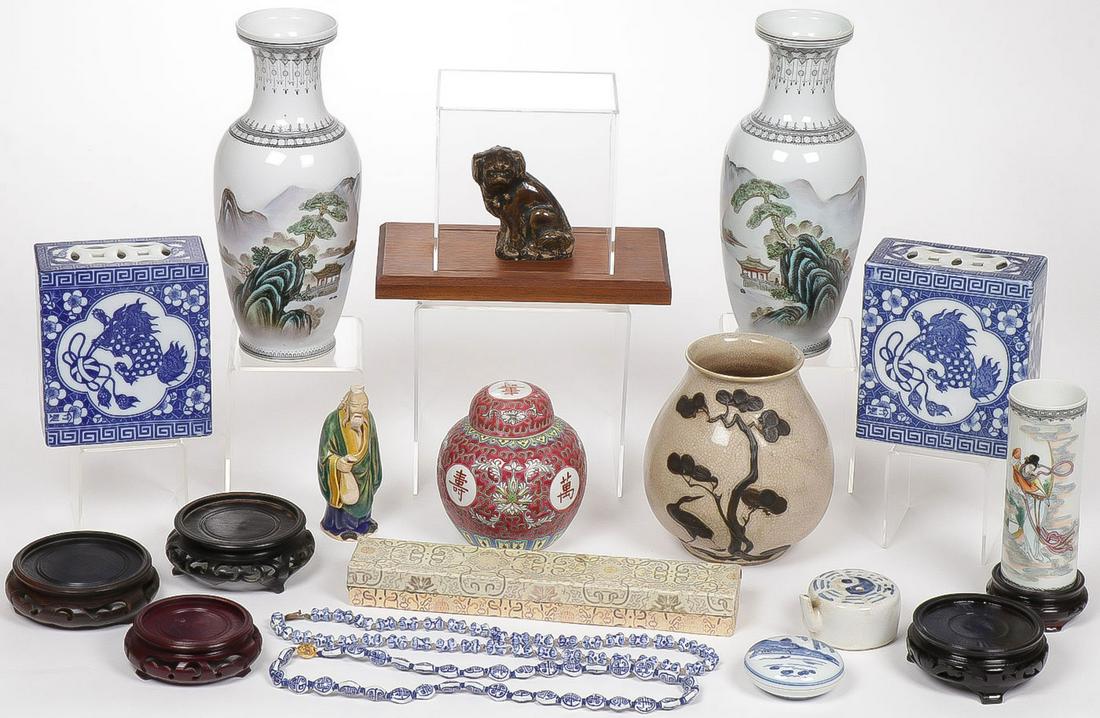 ASIAN DECORATIVE ARTS GROUP: ASIAN DECORATIVE ARTS GROUP. Comprising an interesting group of 16 individual pieces including a pair of matching vases with scenic decoration, a pair of blue and white pillows, a famille rose decorat