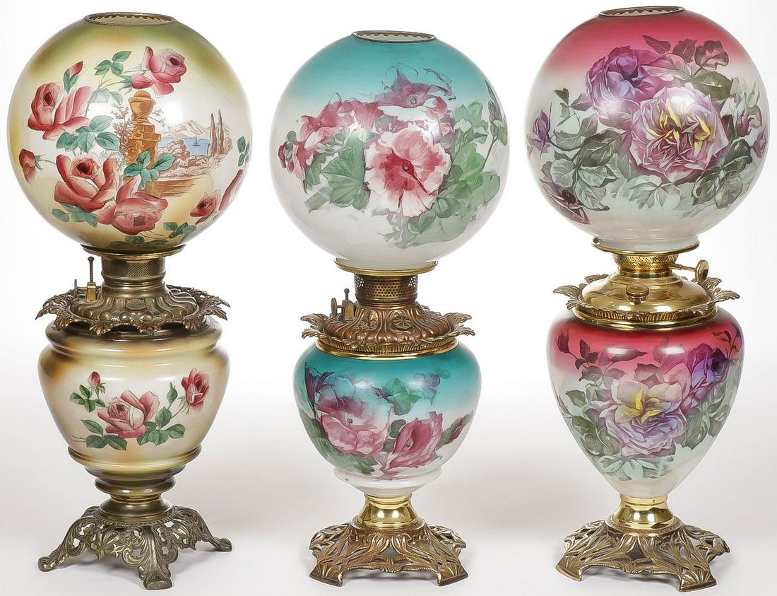THREE GWTW PARLOR LAMPS: THREE GWTW PARLOR LAMPS. The first electrified, the other two with original fonts and burners. Greatest height 23.25 inches. SHIPPING NOTICE: Jackson's is your sole and only source for one stop p