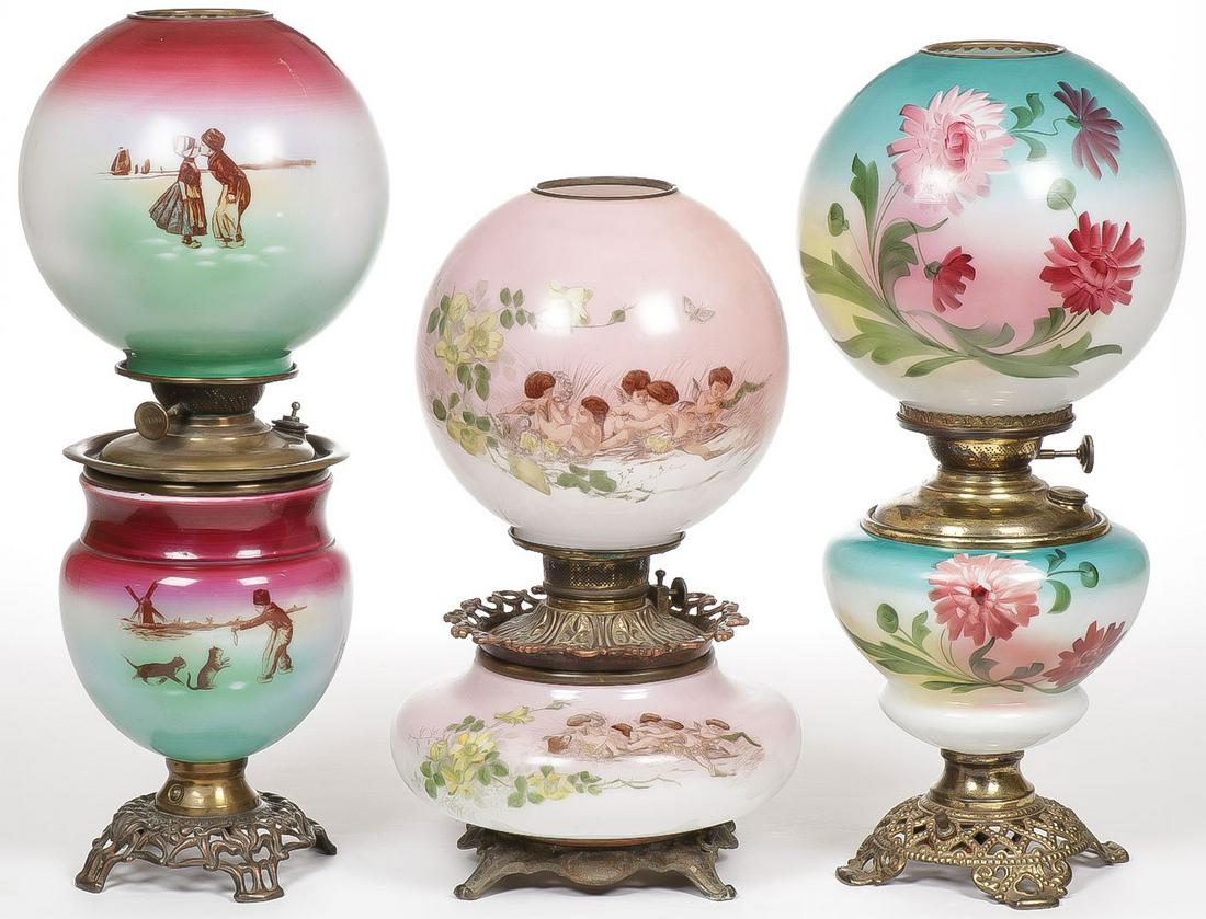 THREE GWTW PARLOR LAMPS: THREE GWTW PARLOR LAMPS. Each electrified. Greatest height 21.5 inches. SHIPPING NOTICE: Jackson's is your sole and only source for one stop packing and shipping. With over 50 years of experience