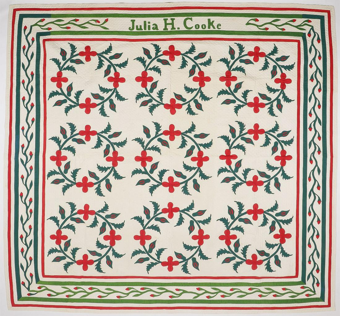 PAIR OF GOOD AMERICAN VINTAGE QUILTS: PAIR OF GOOD AMERICAN VINTAGE QUILTS. Comprising two vintage quilts including a holly wreath quilt signed on the edge Julia H. Cook, 84.5 inches square. As well as another flower circle quilt with saw