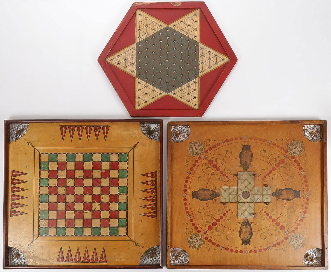 THREE VINTAGE GAME BOARDS: THREE VINTAGE GAME BOARDS. Including two combination carrom boards, one marked "The Owl Game Board Chicago Patented 1901", and an Archarena Combination Star Gameboard. Together with a Chinese 