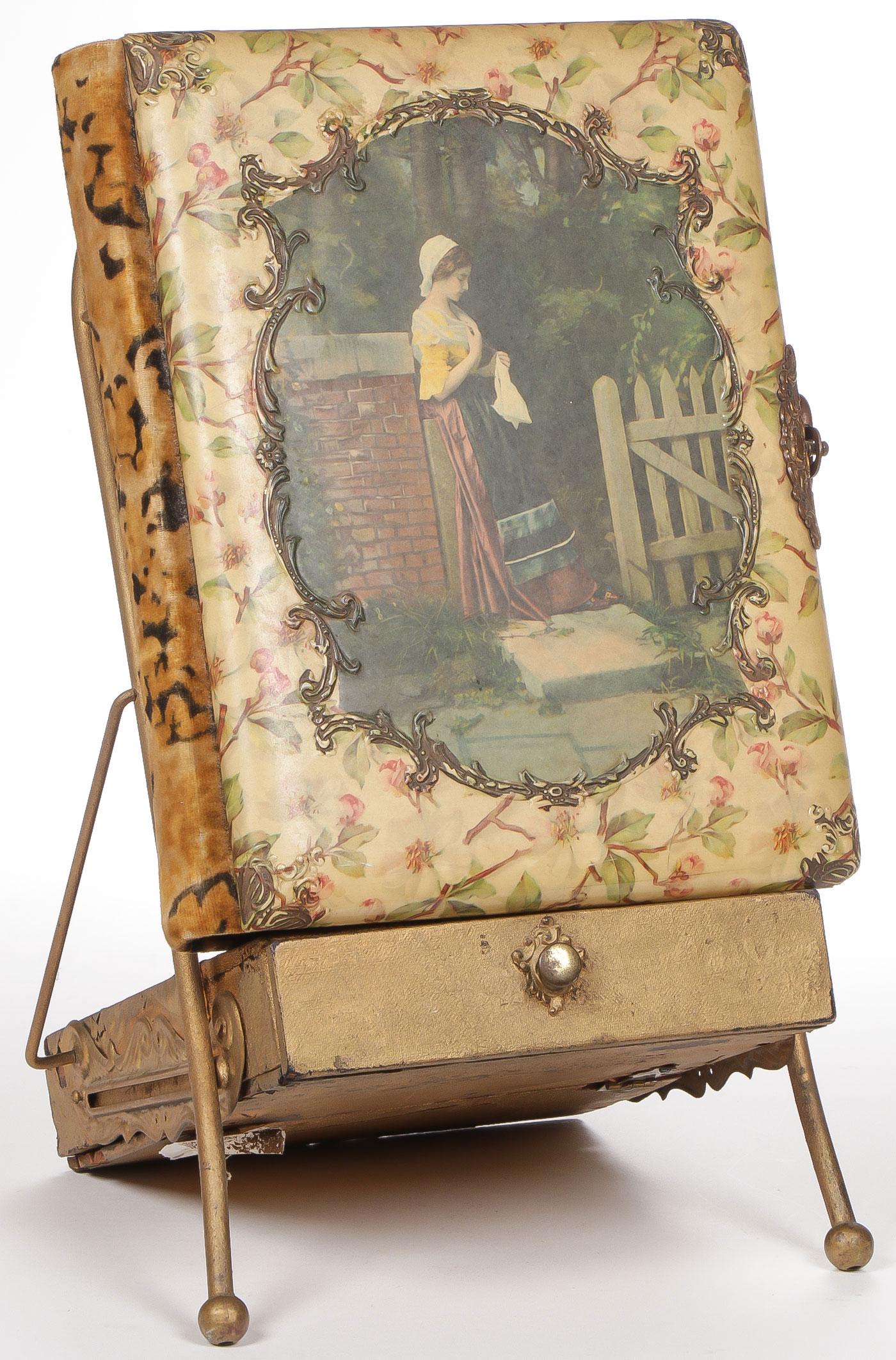 MAGIC LANTERN SLIDES AND MORE: MAGIC LANTERN SLIDES AND MORE. Comprising a late Victorian celluloid photo album, the cover with young maiden near fence resting on a music box, gilt stand. Together with a box of lantern slides from