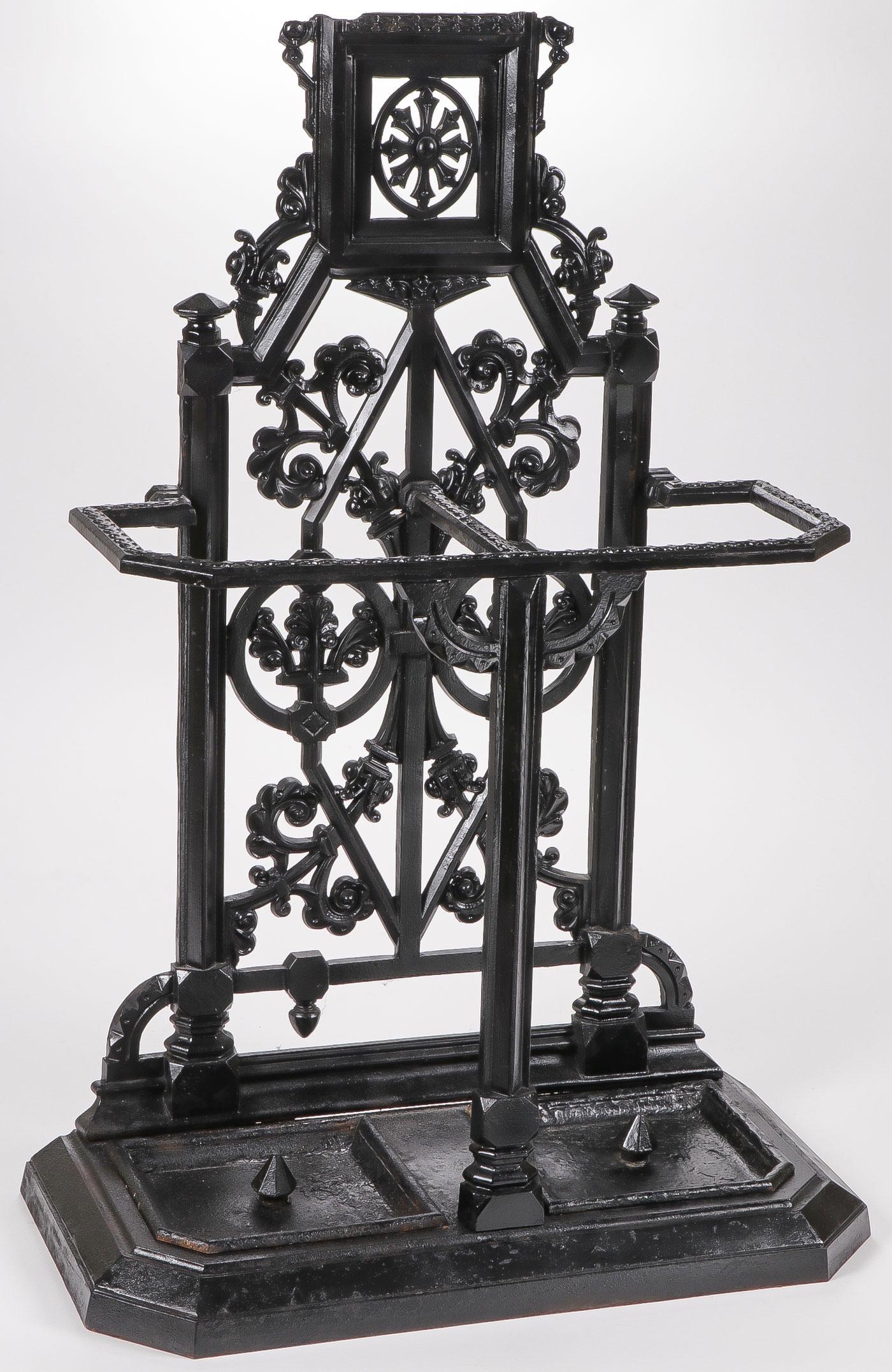 A CAST IRON HALL TREE UMBRELLA STAND BASE: A CAST IRON HALL TREE UMBRELLA STAND BASE. Height 39 inches. SHIPPING NOTICE: Jackson's is your sole and only source for one stop packing and shipping. With over 50 years of experience, our profe