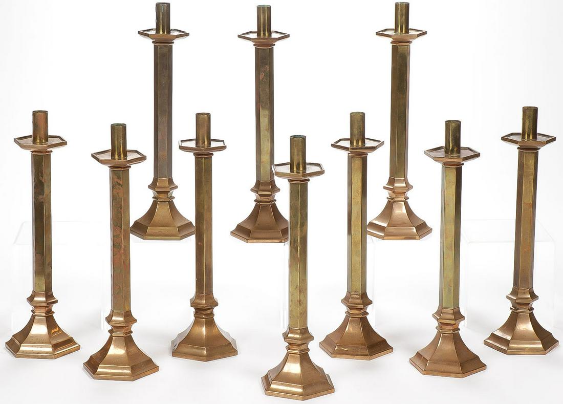 10 BRASS ALTAR CANDLESTICKS: 10 BRASS ALTAR CANDLESTICKS. Comprising ten matching bronze altar candlesticks with octagon base and drip pan, height 16 inches. SHIPPING NOTICE: Jackson's is your sole and only source for one st