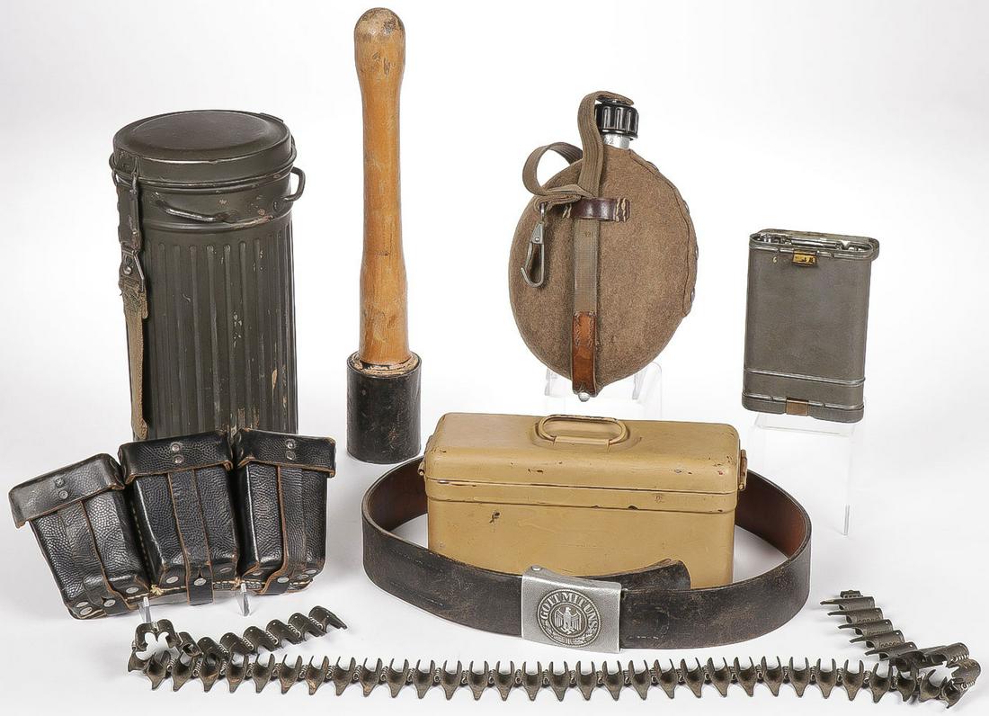 GERMAN WWII FIELD GEAR: GERMAN WWII FIELD GEAR. Comprising a good Heer aluminum pebble finish buckle on original named leather belt, a good m31 wool covered aluminum canteen dated '42 and with plastic screw on cap and or