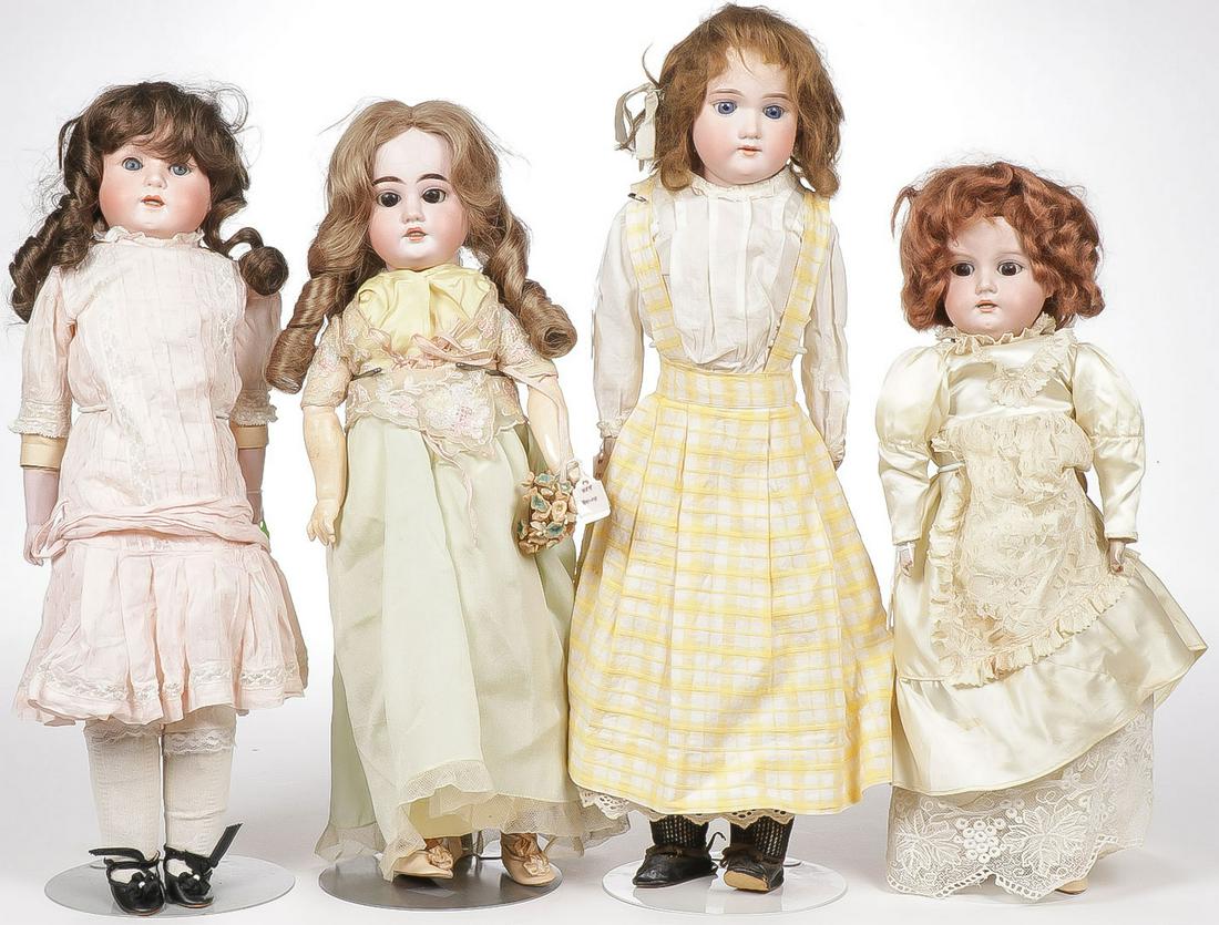 FOUR VINTAGE GERMAN BISQUE DOLLS: FOUR VINTAGE GERMAN BISQUE DOLLS. Each with human hair wigs, including a 22-inch A&M Florodora with sleep eyes and open mouth, a 20-inch A&M with jointed compo body, an A&M 17-inch with ma