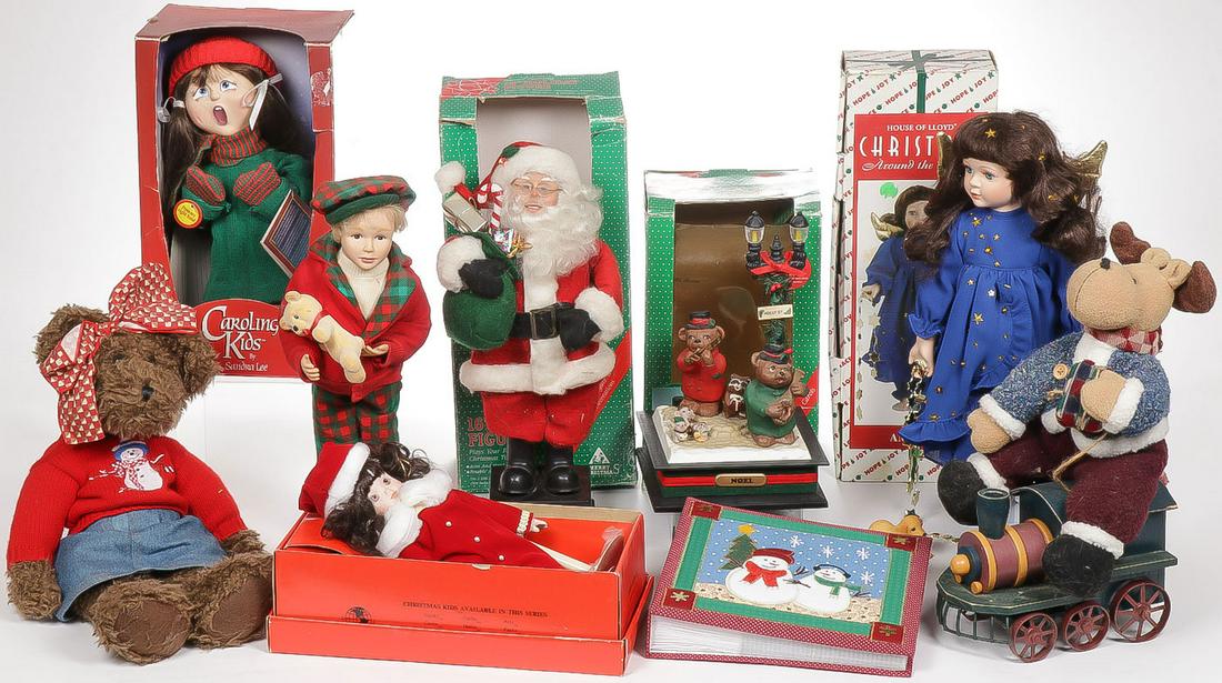 ASSORTED CHRISTMAS DOLLS AND DECORATIONS: ASSORTED CHRISTMAS DOLLS AND DECORATIONS. Comprising nine individual items, including various dolls in original boxes as shown, a musical Holiday Scene with animals, a teddy bear, a stuffed moose on t