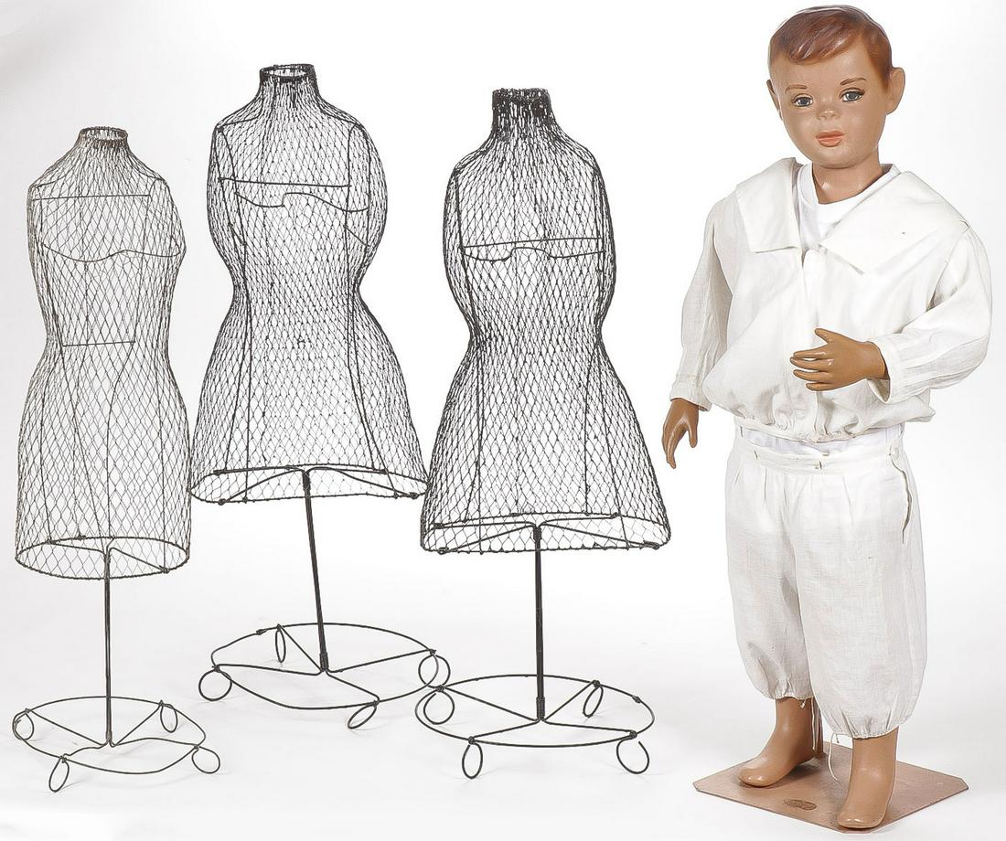 VINTAGE MANNEQUIN GROUP: VINTAGE MANNEQUIN GROUP. Comprising three children's size wire mesh form store mannequins and a 1950's figural boy mannequin in white cotton outfit. Greatest height 37.5 inches. SHIPPING NOTI