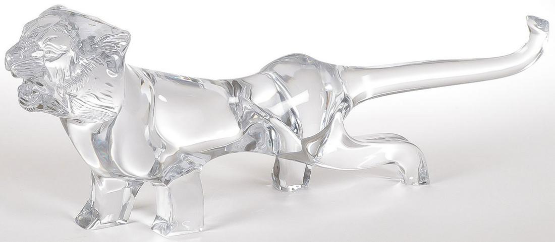 A DAUM CRYSTAL PROWLING TIGER: A DAUM CRYSTAL PROWLING TIGER. Very good condition, no damage. Signed on base. Length 22.5 inches.SHIPPING NOTICE:Jackson's is your sole and only source for one stop packing and shipping. With over