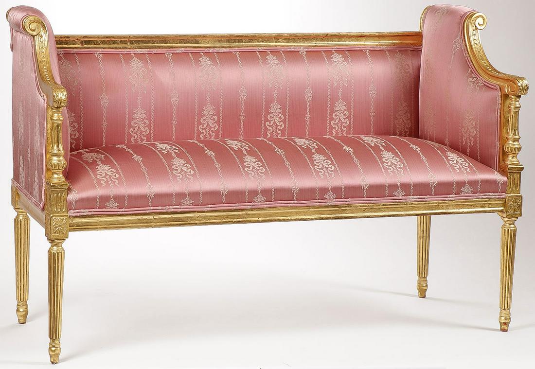 A FRENCH STYLE GILT SETTEE: A FRENCH STYLE GILT SETTEE. Comprising an attractive petite gilt wood settee with fluted tapering legs, acanthus arm rests, and silk fabric. Height 31 inches, width 47 inches, depth 19 inches.SHIPPING