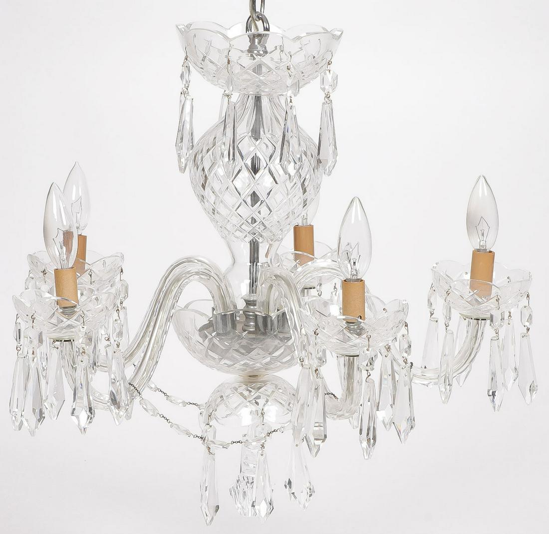 A WATERFORD CRYSTAL 5-LIGHT CHANDELIER: A WATERFORD CRYSTAL 5-LIGHT CHANDELIER. Comprising a Waterford crystal hanging chandelier with five light sockets draped with crystal prism swag, with suspended prisms throughout (most marked Waterfor