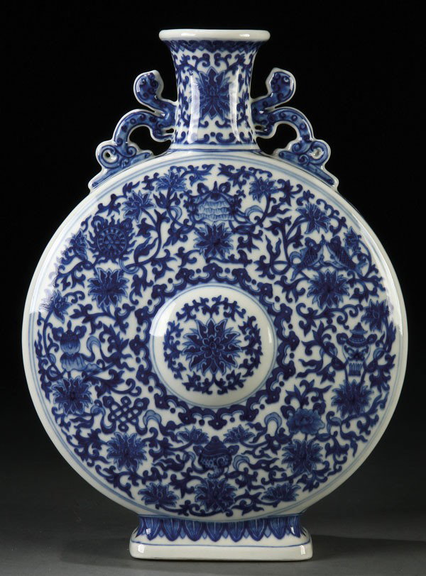 A VERY FINE CHINESE BLUE/WHITEPORCELAIN MOON FLASK: A VERY FINE CHINESE BLUE/WHITE DECORATED PORCELAIN "MOON FLASK," Of flattened pillow form raised on a flared rectangular foot decorated with "interlocking lotus" and Buddhist symbols below a corseted 