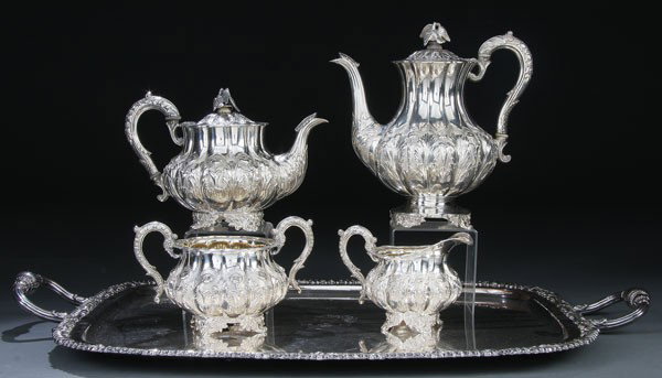 GEORGE IV SILVER 4 PIECE COFFEE AND TEA SERVCE: A GEORGE IV SILVER FOUR-PIECE COFFEE AND TEA SERVICE, LONDON, 1830, MARK OF JONATHAN HAYNE. Comprising a coffee pot, tea pot, sugar bowl and cream jug. Each of bulbous, melon ribbed form with repousse