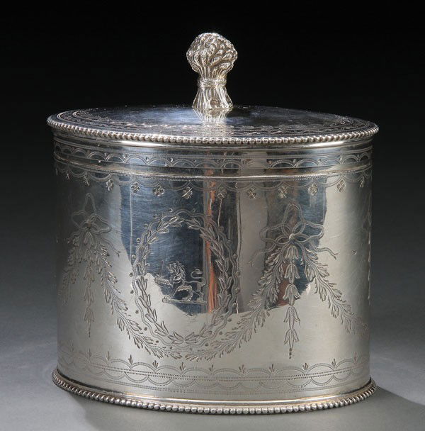 A VICTORIAN SILVER TEA CADDY CHARLES STUART HARRIS: A VICTORIAN SILVER TEA CADDY, LONDON, 1868, MARK POSSIBLY OF CHARLES STUART HARRIS. Of oval form chased with festoons and bell flowers flanking an oval foliate cartouche with an heraldic lion below an