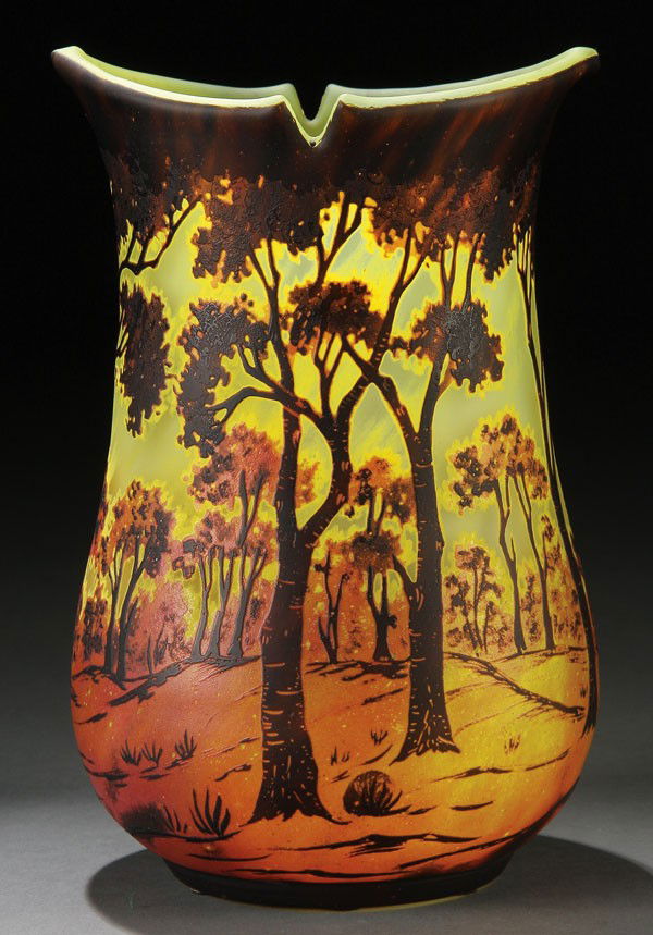 A FINE DAUM NANCY SCENIC CAMEO GLASS VASE: A FINE DAUM NANCY SCENIC CAMEO GLASS VASE, EARLY 20TH CENTURY. Of corseted bulbous form in lime shaded grey glass overlaid with lemon, amethyst and brown colored glass, cut with a scene of dense folia