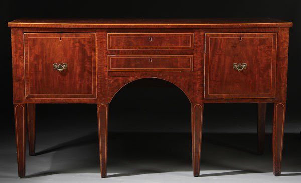 HEPPLEWHITE INLAID MAHOGANY SIDEBOARD: A HEPPLEWHITE INLAID MAHOGANY SIDEBOARD, CIRCA 1800. With flame mahogany top and satinwood band inlay above four drawers raised on tapered legs (slightly reduced). Height 34 inches (86.5 cm), length 6