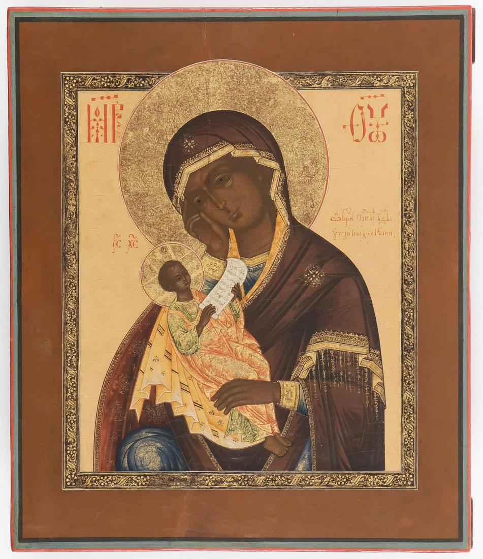 A VERY FINE RUSSIAN ICON, MSTERA, C. 1890: A VERY FINE RUSSIAN ICON, MSTERA, C. 1890. Comprising a very finely painted image of the Soothe the Ills Mother of God, the Virgin cradles the infant Christ who holds a scroll. The inner kovcheg with 
