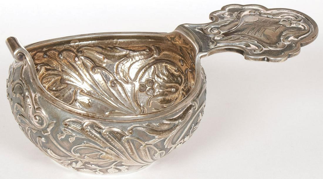 RUSSIAN CASED SILVER KOVSH, ST. PETERSBURG: RUSSIAN CASED SILVER KOVSH, ST. PETERSBURG, C. 1900. The silver kovsh of traditional form the sides repoussed with scrolling flowers in the Art Nouveau style and the handle engraved with Cyrillic mono