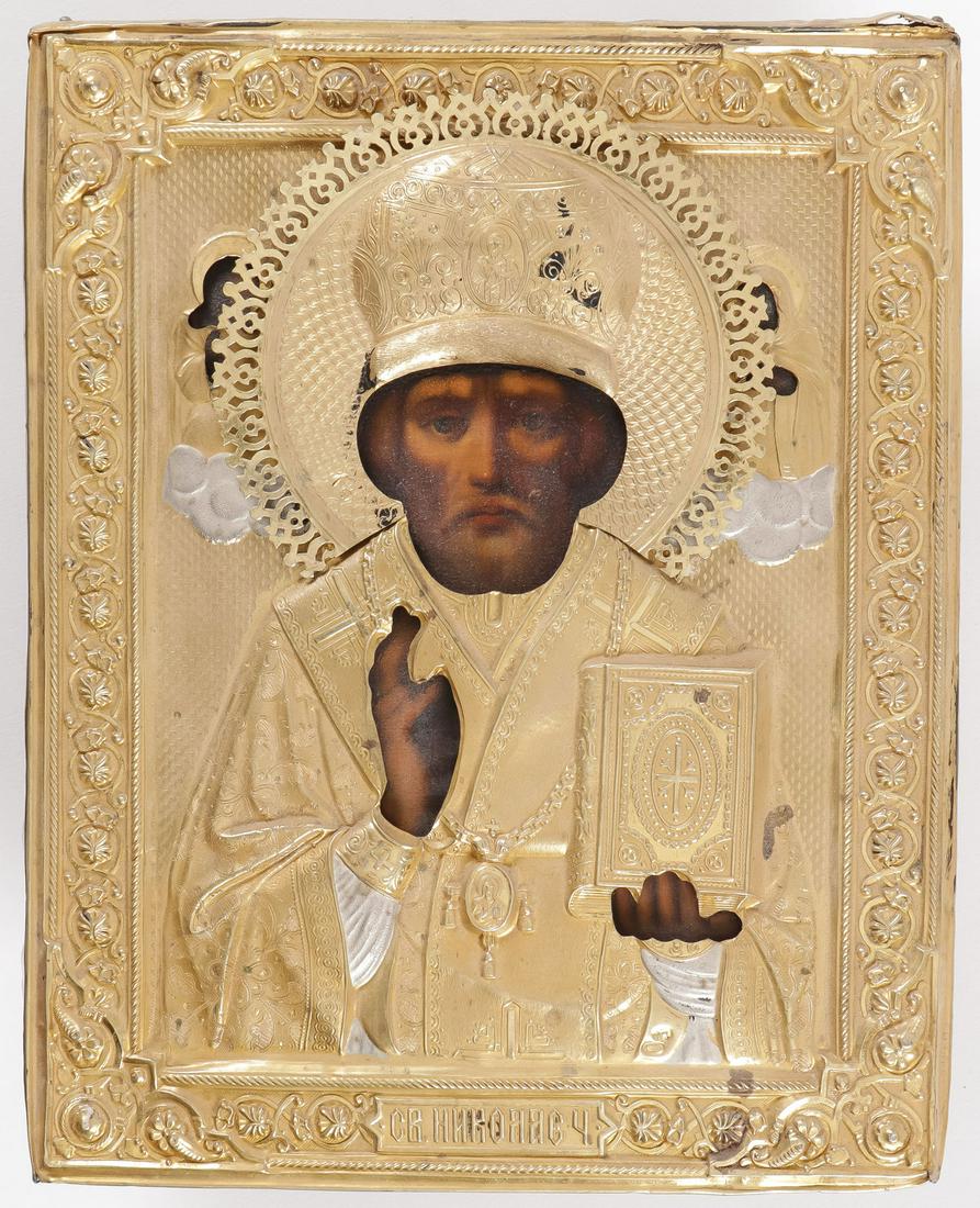 RUSSIAN ICON OF ST. NICHOLAS, MOSCOW, C. 1908: RUSSIAN ICON OF ST. NICHOLAS, MOSCOW, C. 1908. Traditionally depicted. The entire image overlayed with an ornate two-tone silver gilt repoussed and chased oklad. Hallmarked Moscow, 1908-1917, Cyrillic