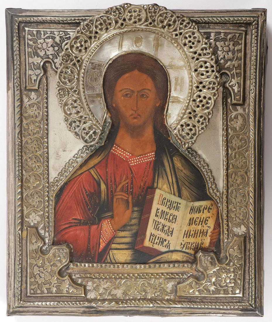 A RUSSIAN ICON OF CHRIST, 19TH CENTURY: A RUSSIAN ICON OF CHRIST, 19TH CENTURY. Traditionally painted in the old style, Christ holds an open book of Gospels to Matthew 11:28, overlaid with an attractive silver plated repousse and chased okl