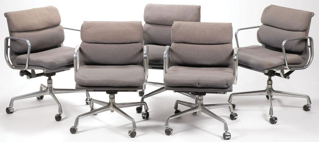 CHARLES EAMES/HERMAN MILLER SOFT PAD ARM CHAIRS: CHARLES EAMES/HERMAN MILLER SOFT PAD ARM CHAIRS. Comprising five circa 1985 low back Soft pad rolling office chair by Charles Eames for Herman Miller, upholstered in blue fabric, each with original ma