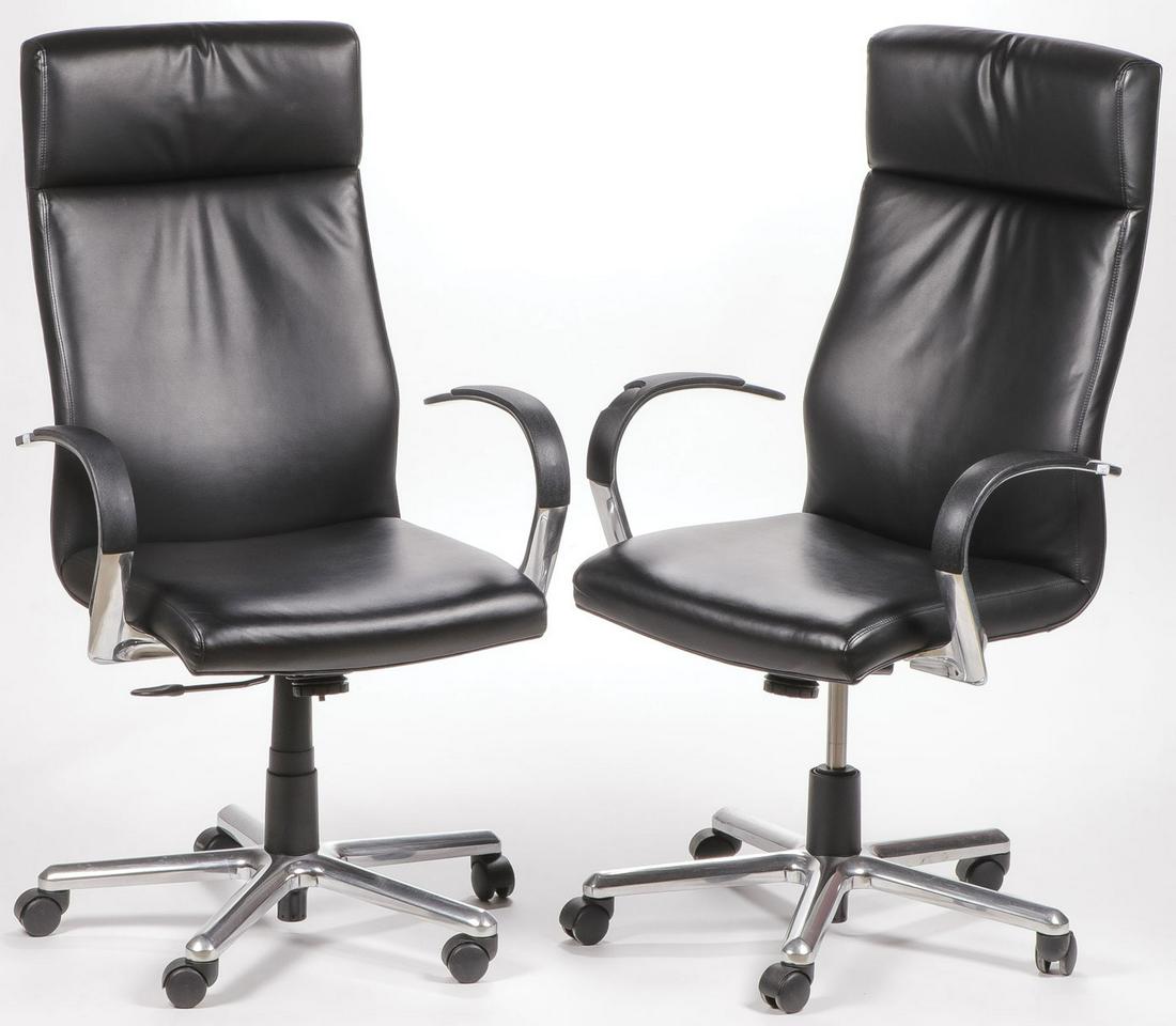 PR JACK CARTWRIGHT LEATHER EXECUTIVE CHAIRS: PR JACK CARTWRIGHT LEATHER EXECUTIVE CHAIRS. Comprising two 2013 manufactured Jack Cartwright rolling office arm chairs with black leather upholstery, height 48 inches, width 27 inches, depth 20 inche
