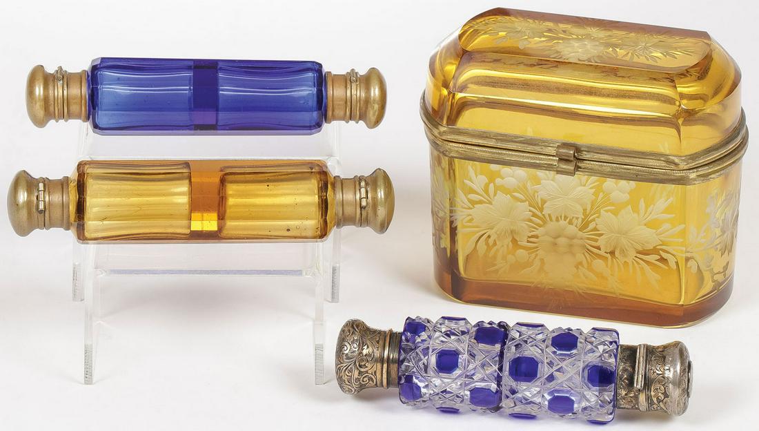 VICTORIAN GLASS PERFUMES & DRESSER BOX: VICTORIAN GLASS PERFUMES & DRESSER BOX. Comprising a casket form beveled glass box with brass rim and hinge, overall etched floral motif. Height 3.75 inches. Together with three double ended glass per