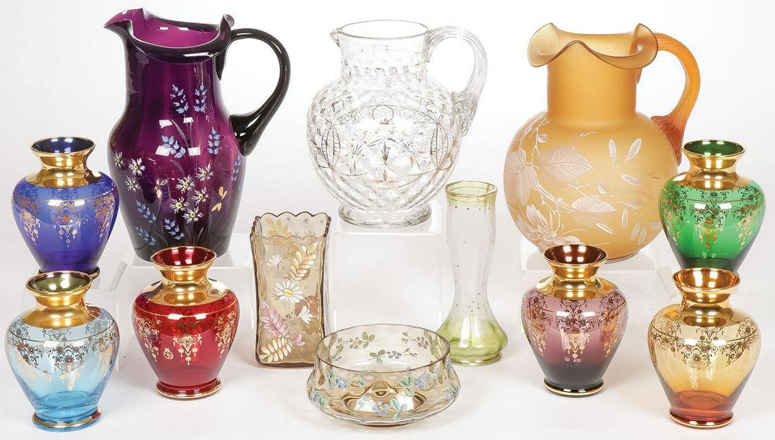 12 PIECE ART GLASS GROUP: 12 PIECE ART GLASS GROUP. Comprising a matching set of six contemporary Murano gilded vases in varying colors. height 5 inches. Together with three pitchers with applied handles, each hand decorated w