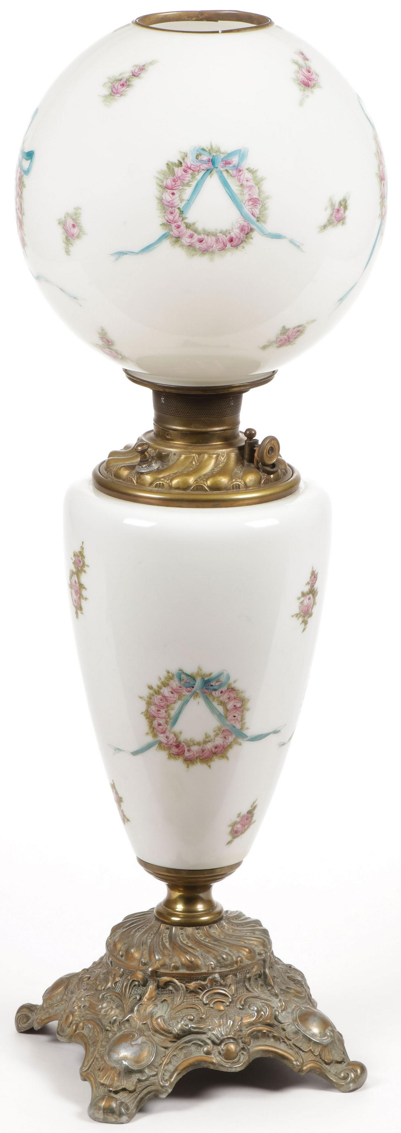 LARGE VICTORIAN GWTW PARLOR LAMP: LARGE VICTORIAN GWTW PARLOR LAMP. Comprising an attractive finely decorated lamp depicting flower wreaths and ribbon swags on a white ground, electrified, needs rewiring. Height 30 inches, not includi