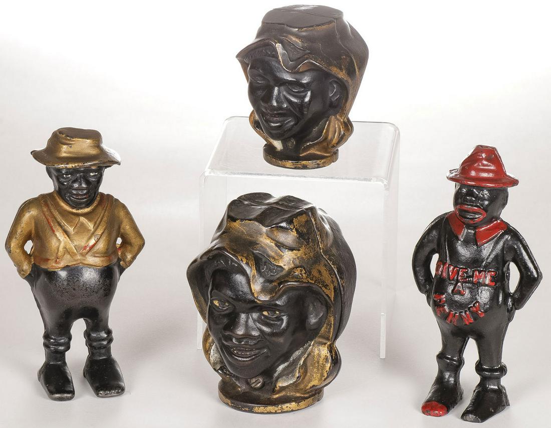 FOUR CAST IRON STILL BANKS: FOUR CAST IRON STILL BANKS. Comprising four individual polychromed cast iron still banks each of black motif including two double faced head banks and two standing banks, as shown. Greatest height 5.6
