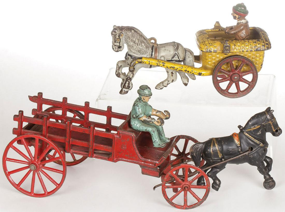 TWO CAST IRON ANTIQUE TOYS: TWO CAST IRON ANTIQUE TOYS. Comprising a Chester Gump wagon and cart in original paint Length 7.5 inches, and a horse drawn wagon with driver also with original paint, length 13.25 inches.SHIPPING NOT