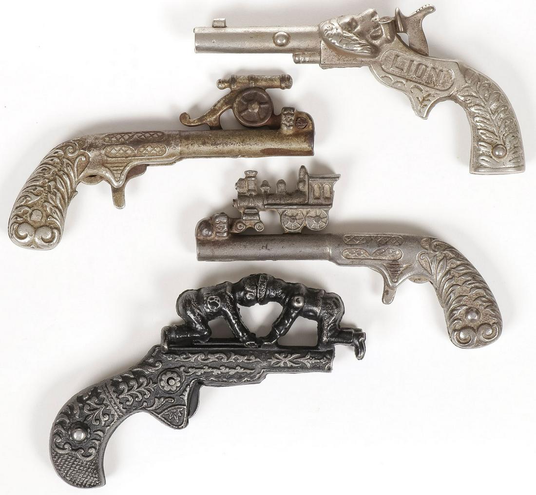 4 ANIMATED CAP GUNS: 4 ANIMATED CAP GUNS. Comprising four individual cap guns, of various configurations and finishes, as shown, various ages. Greatest length 5 inches.SHIPPING NOTICE:Jackson's is your sole and only sou