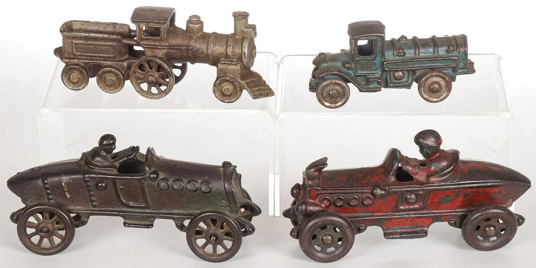 CAST IRON RACERS, TRUCK AND TRAIN: CAST IRON RACERS, TRUCK AND TRAIN. Comprising two cast iron racers, probably Hubley, a cast iron fuel tank, and a locomotive. Each in original finish. Greatest length 5.5 inches. SHIPPING NOTICE: Jack