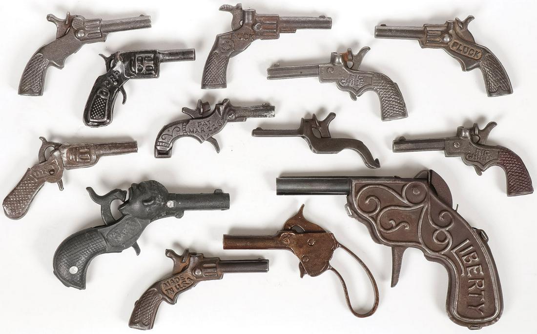 VINTAGE CAP GUN LOT: VINTAGE CAP GUN LOT. Including over 20 individual examples of various shapes, sizes, makers, and materials, as shown. Greatest length 6 inches.SHIPPING NOTICE:Jackson's is your sole and only source