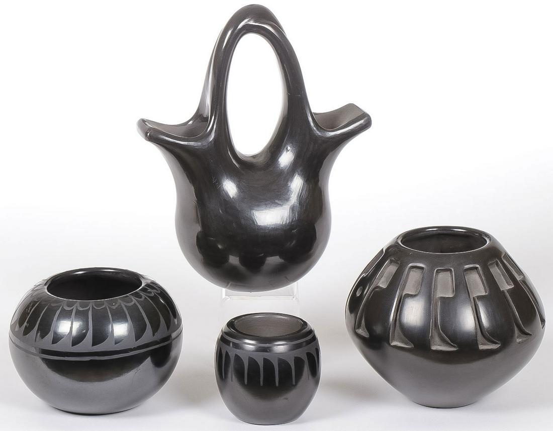 FOUR SOUTHWEST BLACKWARE POTTERY VESSELS: FOUR SOUTHWEST BLACKWARE POTTER VESSELS. Comprising a carved black jar with feather tip designed shoulder, signed "Angela Salazar Santa Clara", height 4.1 inches, a black-on-black jar with bear and fe