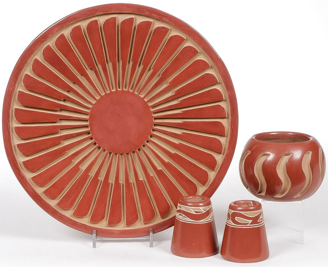 SANTA CLARA SOUTHWEST POTTERY: SANTA CLARA SOUTHWEST POTTERY. Comprising four individual pieces including a large carved feather plaque signed on underside "Anna Archuleta Santa Clara", diameter 10.5 inches, with original receipt o