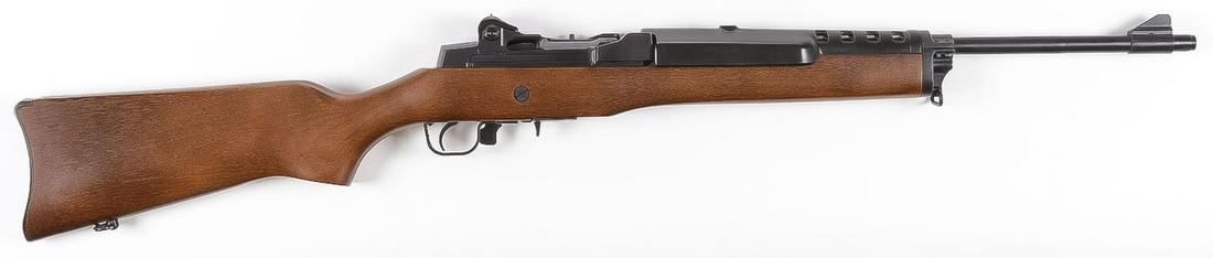 A RUGER MINI-14 SEMI-AUTO RIFLE: A RUGER MINI-14 SEMI-AUTO RIFLE. Walnut stock in .223 caliber with swivel sling mounts, factory magazine, bright clean bore, serial # 186-41114, FFL required. SHIPPING NOTICE: Jackson's is your so