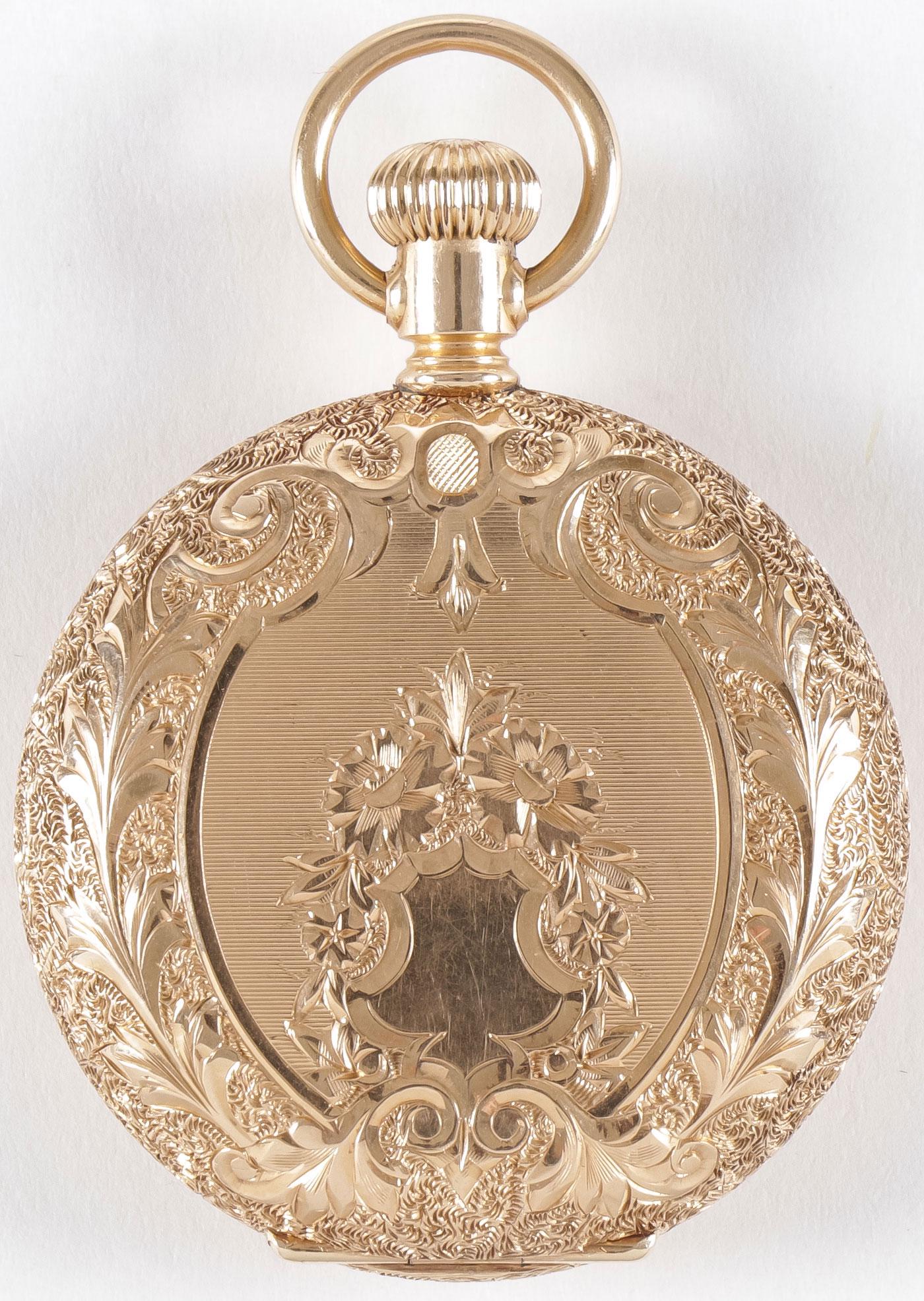 14 K GOLD WALTHAM LADIES WATCH: 14 K GOLD WALTHAM LADIES WATCH. With heavily engraved hunt case enameled dial with jewels and second hand, interior with engraved name and date 1899, movement marked "American Waltham Watch Co" seria