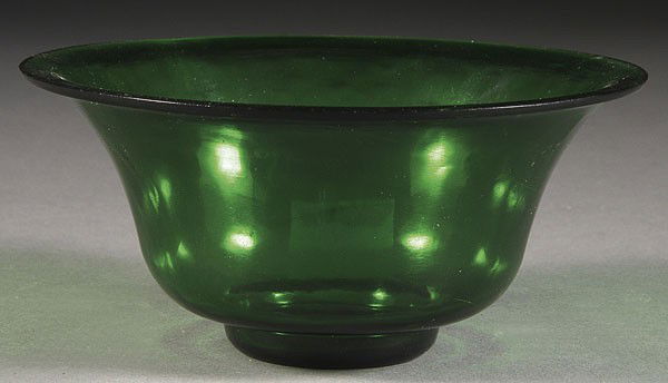 A CHINESE QING EMERALD GREEN PEKING GLASS COUPE: A VERY FINE CHINESE QING DYNASTY EMERALD GREEN PEKING GLASS COUPE, well formed with sloping side below a flared rim and raised on a short foot. Bears printed paper label for Floyd Segel Collection 911