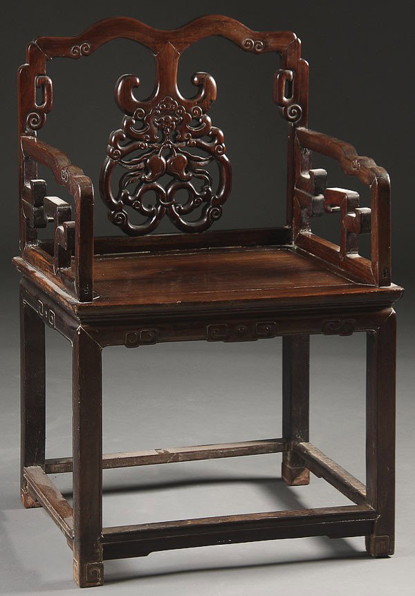 A GOOD CHINESE CARVED ZITAN WOOD ARM CHAIR: A GOOD CHINESE CARVED ZITAN WOOD ARM CHAIR, 19TH/20TH CENTURY. Finely carved with bats and peaches. Height 39 inches, width 25 inches, depth 19 inches.NOTICE TO BIDDERS OF ASIAN ARTS: Because Chinese/