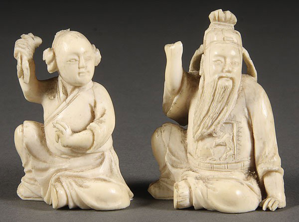 TWO CHINESE CARVED IVORY FIGURES, 20TH CENTURY: TWO CHINESE CARVED IVORY FIGURES, 20TH CENTURY. Of immortals, together with a Japanese carved ivory netsuke. Height 2.25 inches (5.5 cm).