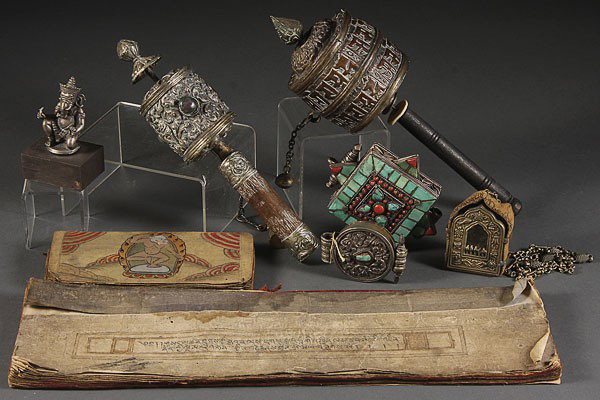 A SINO-TIBETAN HINDU AND BUDDHIST DECORATIVE ARTS: A SINO-TIBETAN HINDU AND BUDDHIST DECORATIVE ARTS GROUP, 19TH/20TH CENTURY. Comprising two embossed metal wheels, three reliquaries including a very fine silver turquoise and coral mounted, a silvered