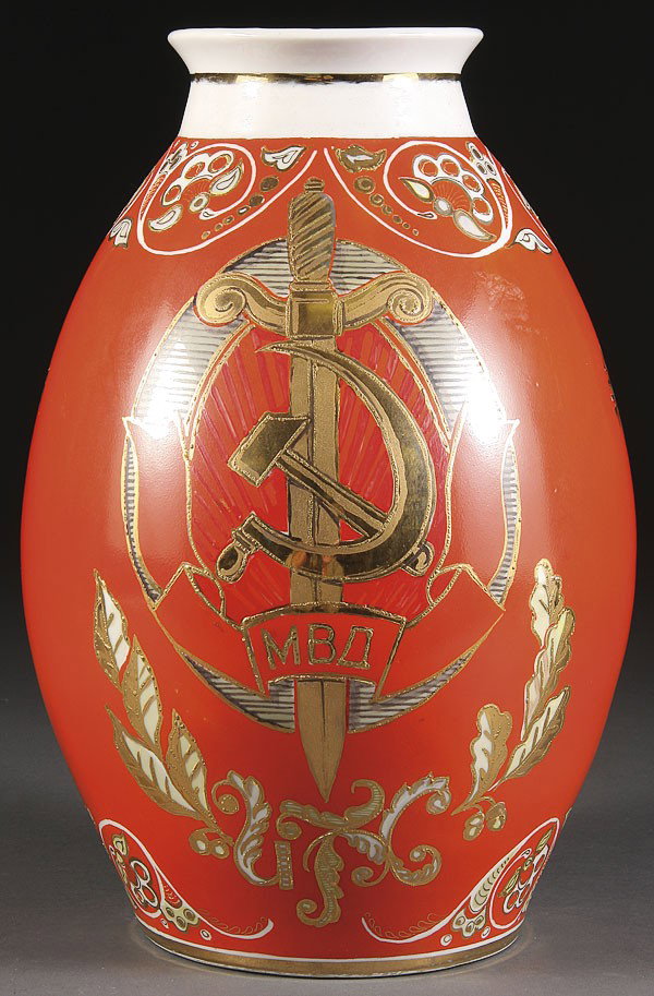 A RUSSIAN SOVIET PORCELAIN MVD PRESENTATION VASE: A RUSSIAN SOVIET PORCELAIN MVD PRESENTATION VASE, circa 1950's. The ovoid vase with gilt decorated MVD-Ministerstvo Vnutrennikh Del (Ministry of Internal Affairs) logo consisting of a hammer and sickl