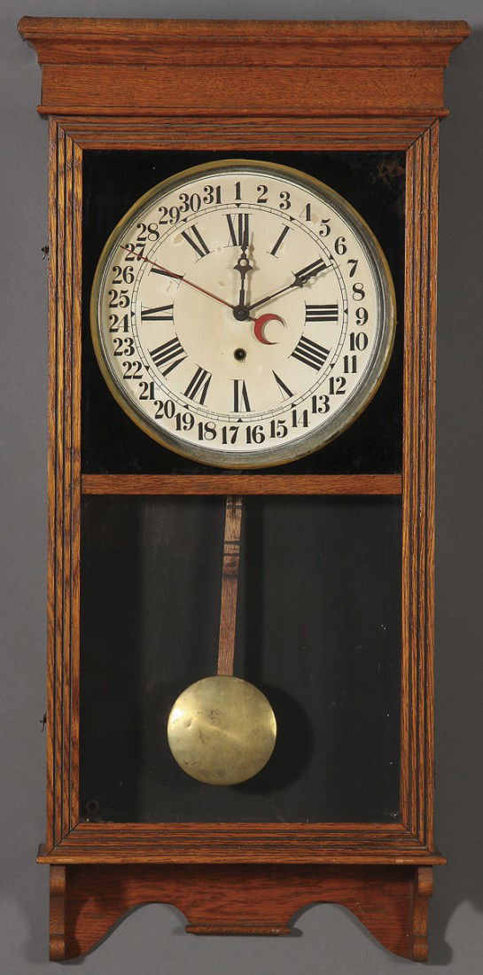 A SESSIONS VICTORIAN OAK REGULATOR CLOCK: A SESSIONS VICTORIAN OAK REGULATOR CLOCK, EARLY 20TH CENTURY, with 31 day calendar indicator. Height 38 inches.
