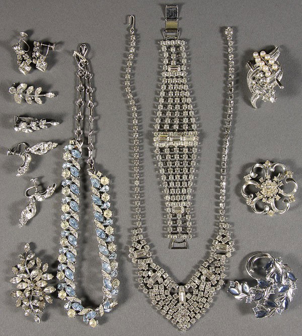 A LARGE ASSORTMENT OF JEWELRY: A LARGE ASSORTMENT OF JEWELRY, including unsigned rhinestone chokers and bracelets, along with clear rhinestone, cameos, stud earrings and more.
