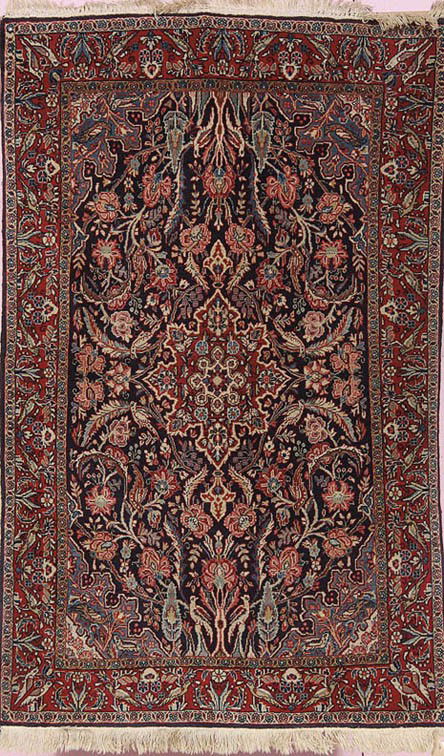 A WEST PERSIAN SAROUK HANDWOVEN ORIENTAL CARPET, M: A WEST PERSIAN SAROUK HANDWOVEN ORIENTAL CARPET, MID 20TH CENTURY, with stylized floral design on red blue ground. 62.5 inches x 39 inches.