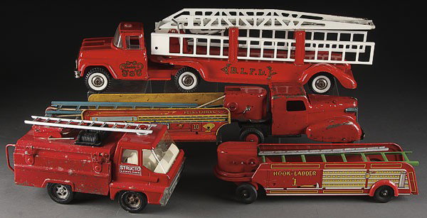 STRUCTO TONKA TOY PRESSED STEEL FIRE TRUCKS, MI: A GROUP OF FOUR TOY PRESSED STEEL FIRE TRUCKS, MID 20TH CENTURY, comprising a structo Tonka, a Wyandotte and a hook and ladder back end. The largest 27 inches.
